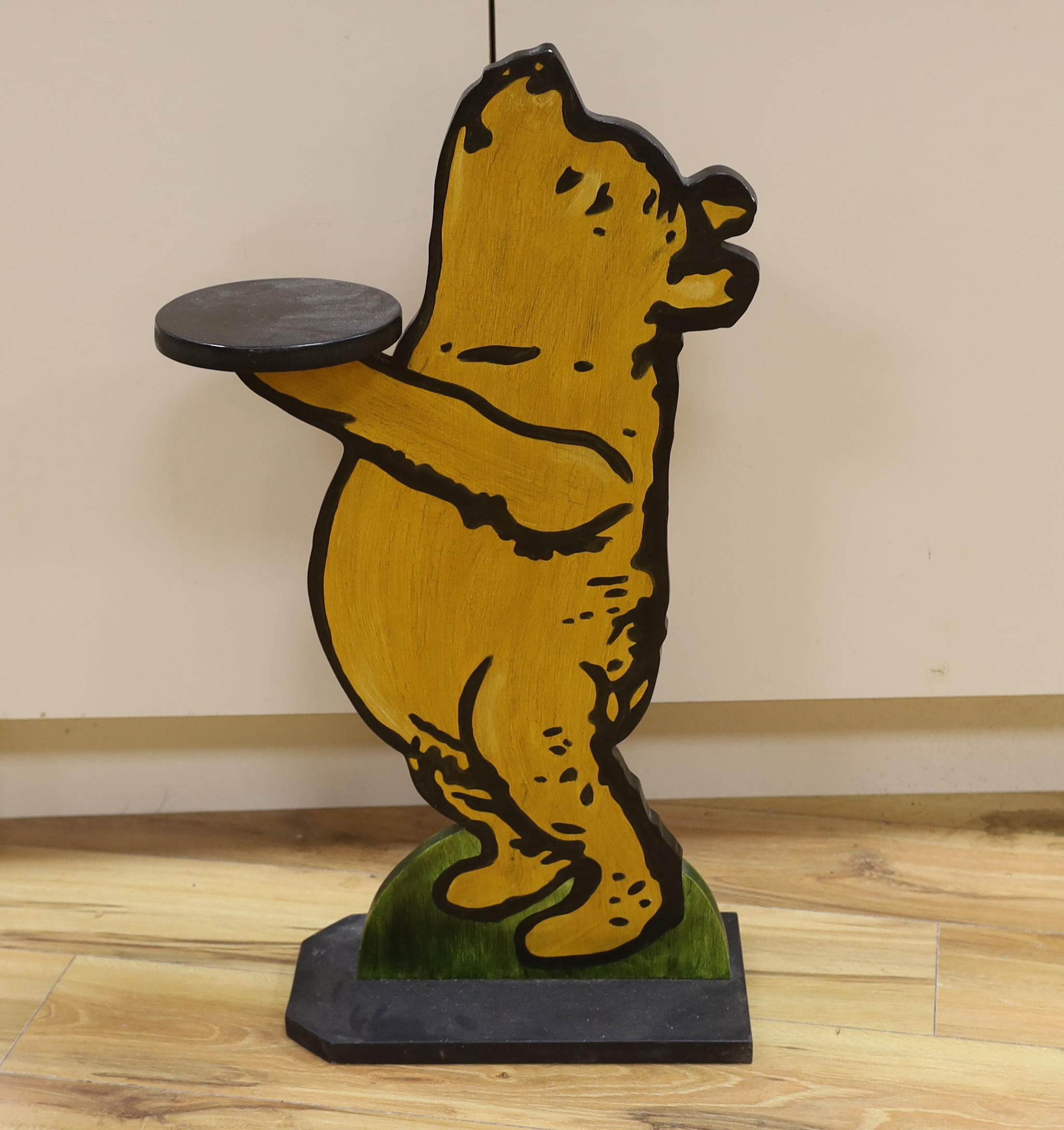 A Winnie the Pooh painted dumb waiter, 75cm high